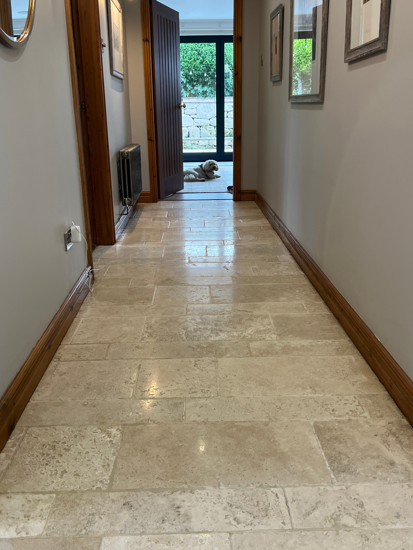 Polished natural stone hallway floor cleaned in Stafford, before professional cleaning